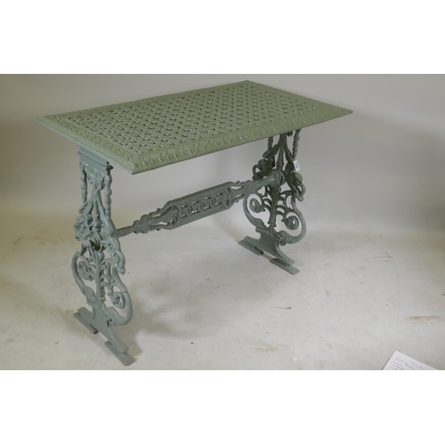 1086 - Painted metal garden table, raised on pierced end supports, 90 x 50 x 68cm