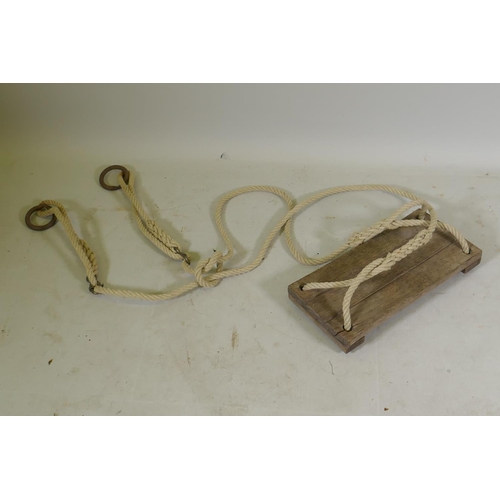 1090 - A vintage rope swing, seat 42 x 20cm, drop approx 180cm, adjustable