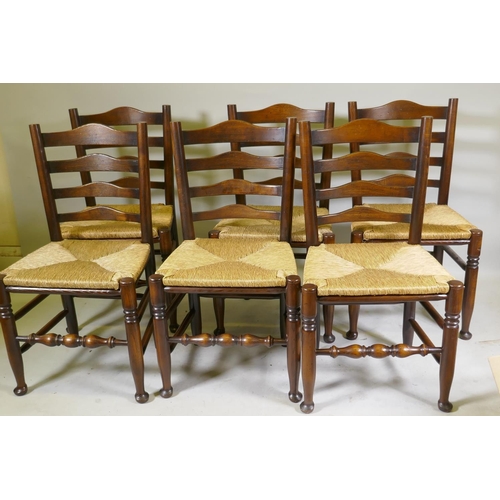 1095 - A set of six ash ladderback chairs with drop in rush seats