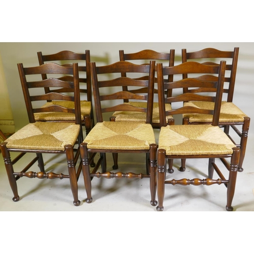 1095 - A set of six ash ladderback chairs with drop in rush seats