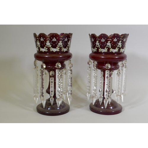 11 - A pair of C19th ruby glass lustres with enamel decoration, AF one base chipped, 37cm high