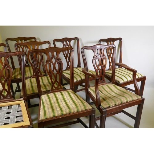 1100 - A set of six plus two mahogany Chippendale style dining chairs with pierced back splats and drop in ... 