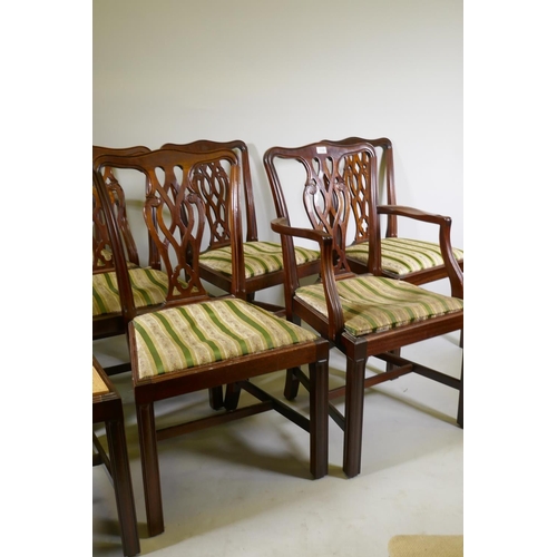 1100 - A set of six plus two mahogany Chippendale style dining chairs with pierced back splats and drop in ... 