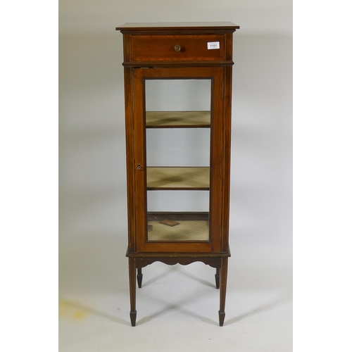 1101 - A Victorian inlaid mahogany four glass display cabinet with single door and two shelves, raised on t... 