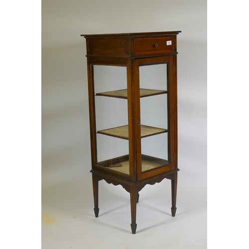 1101 - A Victorian inlaid mahogany four glass display cabinet with single door and two shelves, raised on t... 