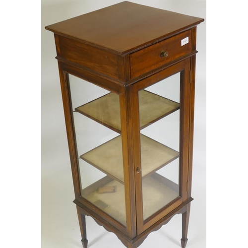 1101 - A Victorian inlaid mahogany four glass display cabinet with single door and two shelves, raised on t... 