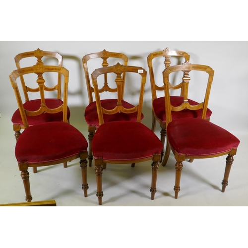 1110 - A set of six Victorian walnut dining chairs with burr walnut and classical urn inlaid decoration, up... 