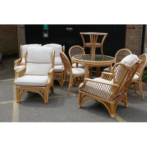 1114 - A Daro bamboo conservatory dining table with glass top and four matching chairs, matching settee and... 