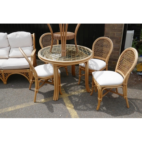 1114 - A Daro bamboo conservatory dining table with glass top and four matching chairs, matching settee and... 