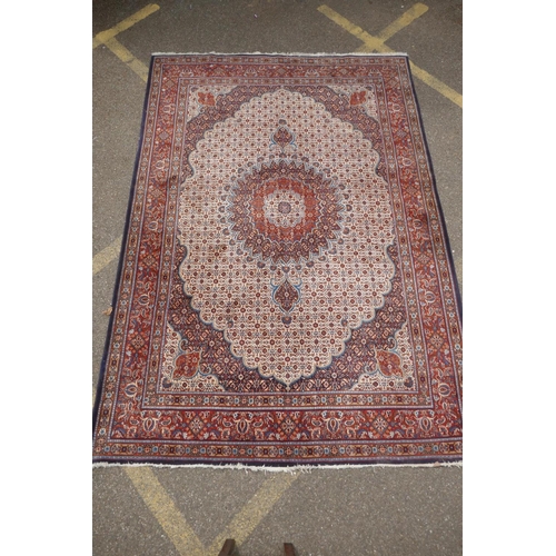 1120 - A Persian blue, cream and terracotta ground wool Kerman carpet, 202 x 292cm