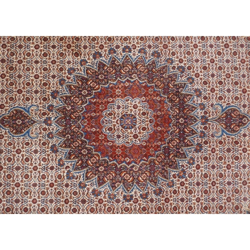 1120 - A Persian blue, cream and terracotta ground wool Kerman carpet, 202 x 292cm