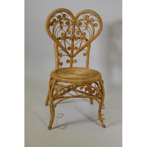 1124 - A vintage bamboo cane chair with heart shaped back