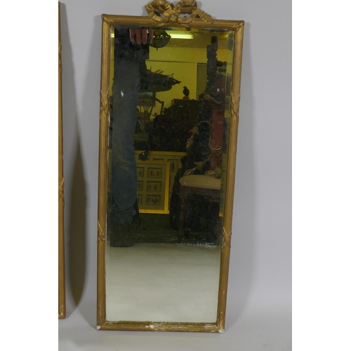 1134 - A vintage wall mirror with bevelled glass and reeded frame, AF, 45 x 73cm, and another smaller