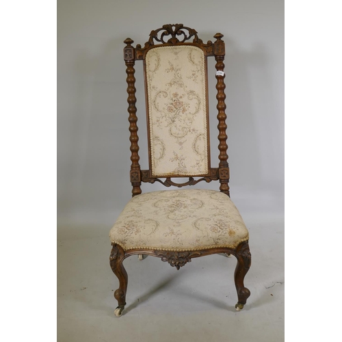 1142 - A Victorian carved walnut high back side chair, with carved crest back and shaped front, raised on c... 