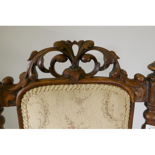 1142 - A Victorian carved walnut high back side chair, with carved crest back and shaped front, raised on c... 