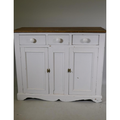 1145 - A C19th painted pine dresser base, with satin walnut top over three drawers and two cupboards, raise... 