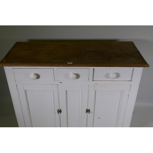 1145 - A C19th painted pine dresser base, with satin walnut top over three drawers and two cupboards, raise... 