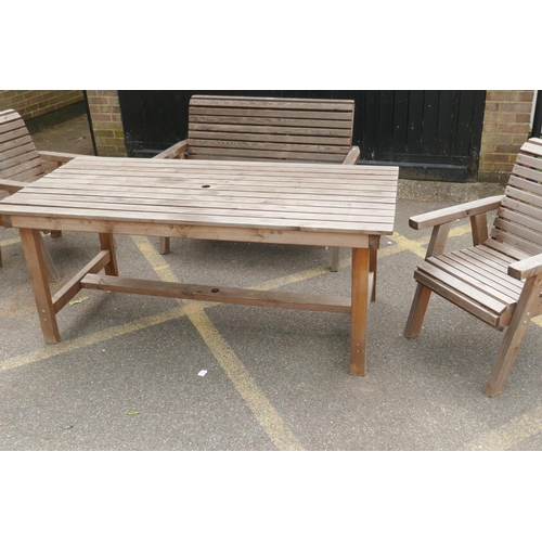 1147 - A Riverco weathered pine two seater garden bench and two chairs, and a matching refectory style tabl... 