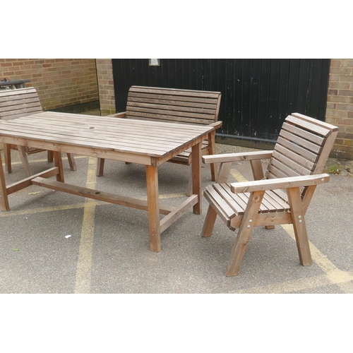 1147 - A Riverco weathered pine two seater garden bench and two chairs, and a matching refectory style tabl... 