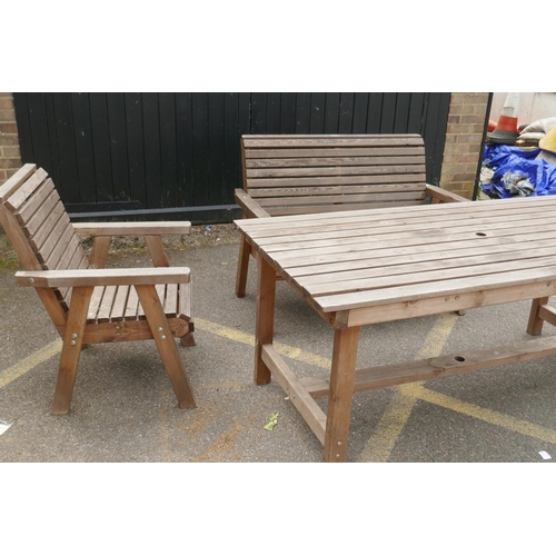 1147 - A Riverco weathered pine two seater garden bench and two chairs, and a matching refectory style tabl... 