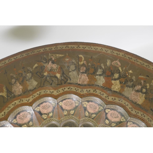 1149 - A vintage Indian brass tray with engraved and enamelled decoration, on a carved folding wood stand, ... 