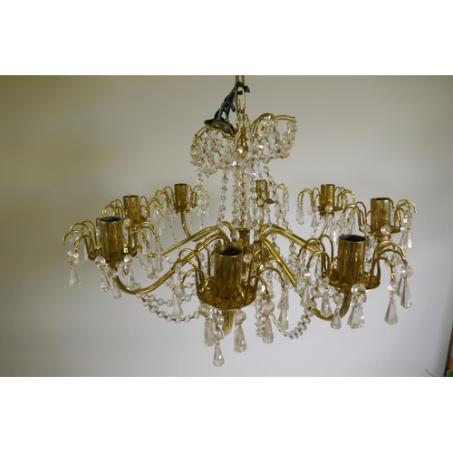 1152 - A pair of vintage Bohemian 'Preciosa' eight branch chandeliers, brass with crystal drops, and a matc... 