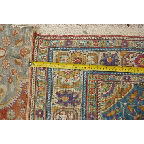 1157 - A Turkish faded silk rug with blue central medallion on a coral field, 120 x 184cm