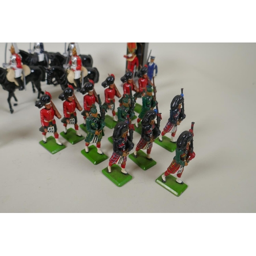 116 - A large collection of loose Britains painted metal models to include mounted Police Officers, HM The... 