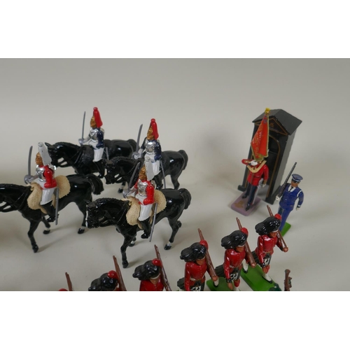 116 - A large collection of loose Britains painted metal models to include mounted Police Officers, HM The... 