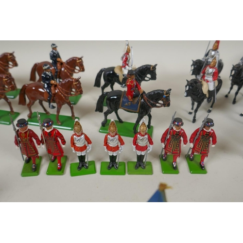 116 - A large collection of loose Britains painted metal models to include mounted Police Officers, HM The... 