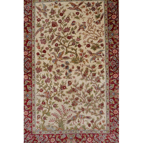 1164 - A Turkish cream ground silk hereke hanging rug with red borders, 78 x 124cm