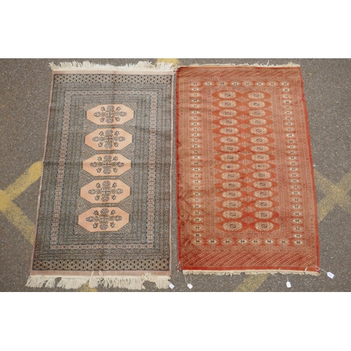 1168 - A terracotta ground Bokhara wool rug, 94 x 150cm, and an Afghan Jalder pink ground rug, 94 x 150cm, ... 