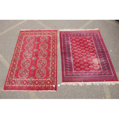 1169 - A red ground Turkman rug, 125 x 162cm, and another red ground Persian design rug, 117 x 182, AF