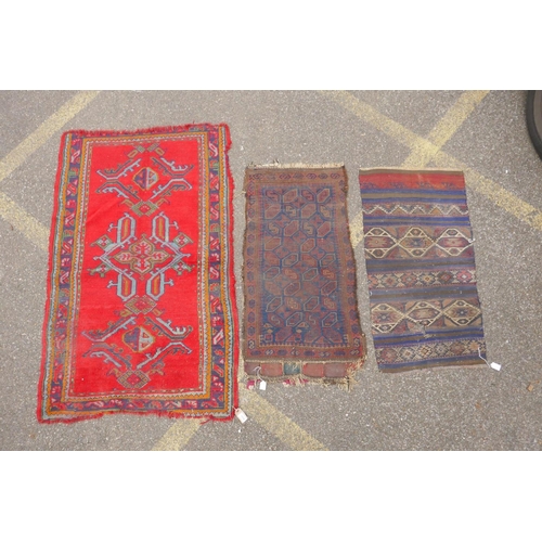 1170 - A red ground Turkish Oushak rug, 94 x 150cm, and an Afghan prayer rug, 60 x 110cm, and a small kilim... 