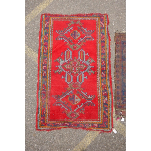 1170 - A red ground Turkish Oushak rug, 94 x 150cm, and an Afghan prayer rug, 60 x 110cm, and a small kilim... 