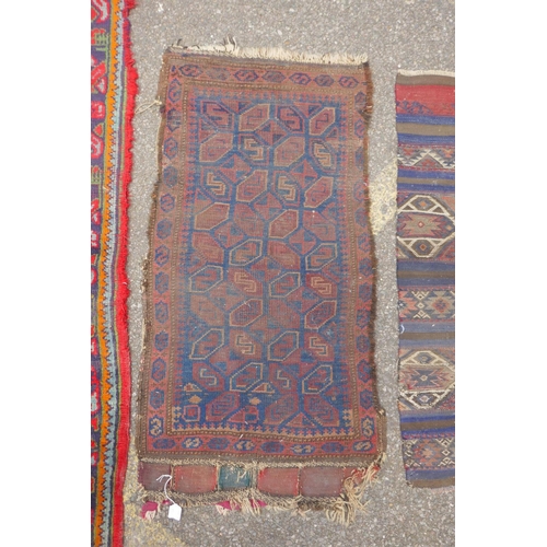 1170 - A red ground Turkish Oushak rug, 94 x 150cm, and an Afghan prayer rug, 60 x 110cm, and a small kilim... 