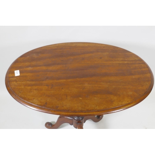 1177 - A Victorian mahogany tilt top occasional table, raised on turned column and tripod supports, 54 x 75... 