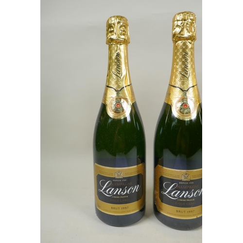 141 - Three bottles of Lanson Gold Label Brut Champagne 1997, and a bottle of Lanson Black Label Brut 2015