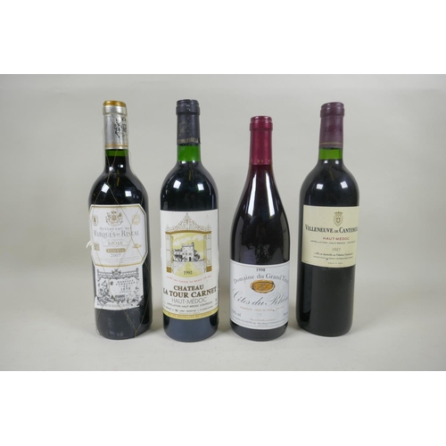 143 - Four bottles of red wine to include a bottle of Marques de Riscal-Rioja Reserva 2007, a Chateau la T... 