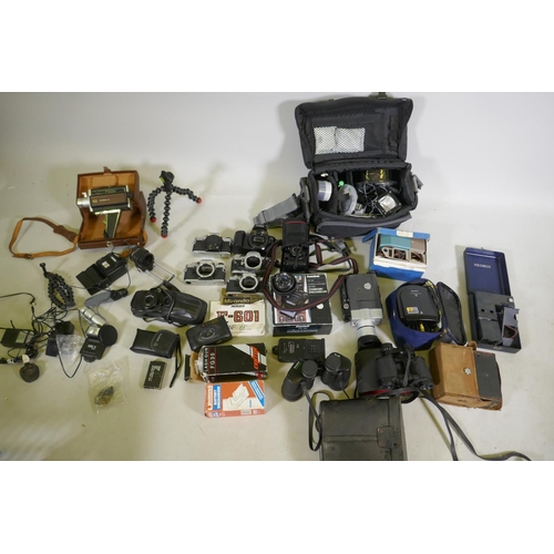 148 - A quantity of 35mm cameras, Pentax and Olympus bodies, Prinzlux binoculars, camera equipment, flashe... 