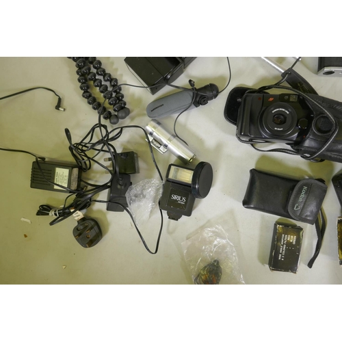 148 - A quantity of 35mm cameras, Pentax and Olympus bodies, Prinzlux binoculars, camera equipment, flashe... 