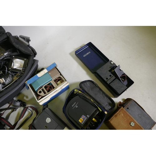 148 - A quantity of 35mm cameras, Pentax and Olympus bodies, Prinzlux binoculars, camera equipment, flashe... 