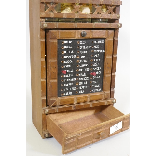 15 - A vintage Holmar spice rack, with revolving door and stock list, 42cm high