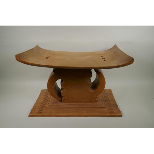 150 - An African carved hardwood Ashanti tribal stool, with personalised dedication to Mark Gilbey from Ko... 