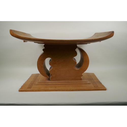 150 - An African carved hardwood Ashanti tribal stool, with personalised dedication to Mark Gilbey from Ko... 