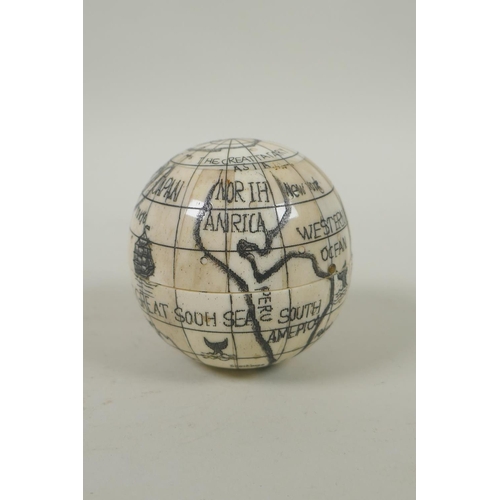 152 - An engraved bone terrestrial globe opening to reveal a compass and sundial, 7cm diameter