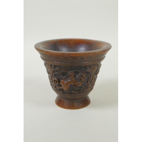 153 - A Chinese faux horn libation cup with twin kylin handles, seal mark to base, 8cm high x 10cm diamete... 