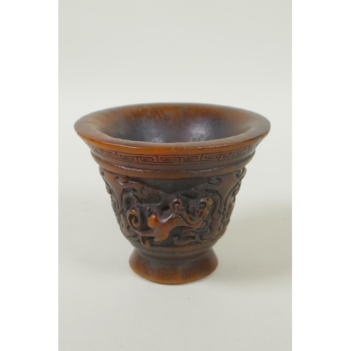 153 - A Chinese faux horn libation cup with twin kylin handles, seal mark to base, 8cm high x 10cm diamete... 