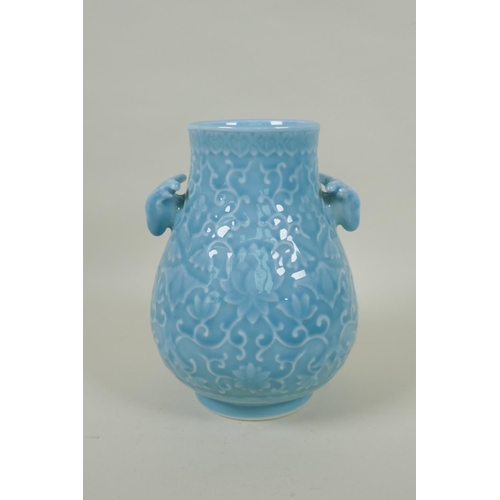 156 - A Chinese celadon glazed porcelain vase with two deer mask handles and underglaze lotus flower decor... 