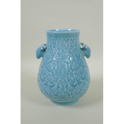 156 - A Chinese celadon glazed porcelain vase with two deer mask handles and underglaze lotus flower decor... 